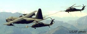 MC-130P Combat Shadow refueling 2 MH-60G Pavehawks